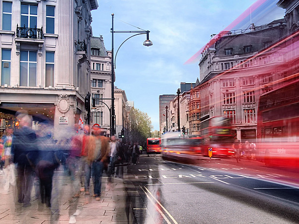 long exposure blurred shot of people and buses on oxford street, London